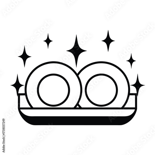 Two clean plates on a dish rack with sparkling stars washing