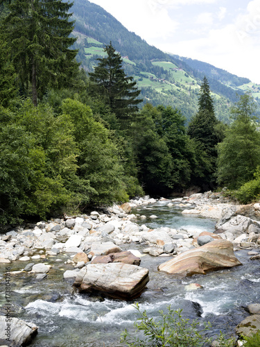 Wild alpine river Passiria in South Tyrol, Italy – flowing water in a forest mountain valley