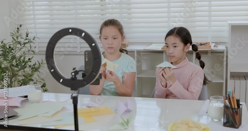 Two girls open youtube channel to teach paper folding 4k video.