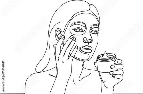 Woman applying face mask