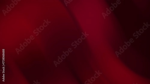 Abstract blurred background with deep red shades suitable for graphic design projects and text overlay elements in marketing materials.