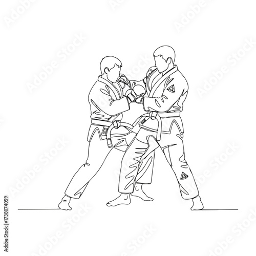 Two judo athletes practicing grappling techniques in training session