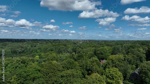 Aerial view of Genappe municipality and city of Wallonia located in the Belgian province of Walloon Brabant. Villas with garden surrounded by forest.