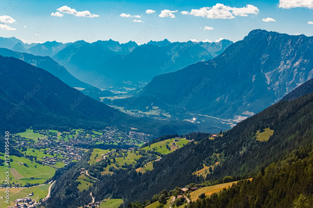 Obraz premium Alpine aerial summer view of Oetz with mountains in the background seen from Mount Acherkogl, Oetztal valley, Tyrol, Austria