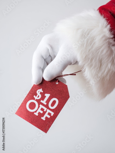 Wallpaper Mural Santa Claus Hand Holding $10 Off Christmas Sale Tag Torontodigital.ca