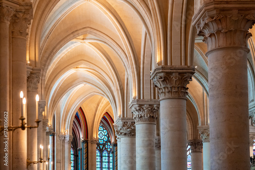 Sequence of columns and arches inside gothic cathedral.