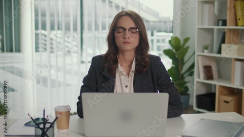 Mindful Breathing. Businesswoman Practicing Stress Relief and Relaxation at Desk, Promoting Mental Health, Focus, and Employee Wellbeing in the Modern Workplace