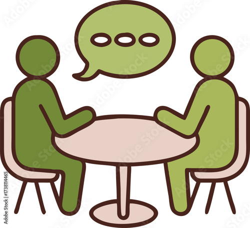 Two people engaged in conversation while sitting at a round table illustrating teamwork discussion and collaborative meetings in a modern setting