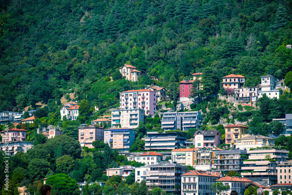 Fototapeta premium Panorama of the shores of Lake Como with villas and mountains in Italy. Cinematic photography. An ideal image for tourism, luxury, real estate, travel and nature themes.