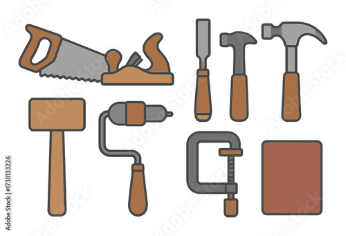 Vintage hand tools collection on wooden background: saw, hammer, chisel, plane, brace, clamp, mallet, sandpaper