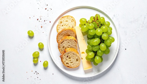 Overhead View of Gourmet Snack with Grapes Bread Cheese and Colorful Sprinkles on White Square Plate in Bright Controlled Lighting