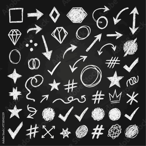 Collection of hand drawn chalk style arrows checkmarks stars and other symbols on a blackboard