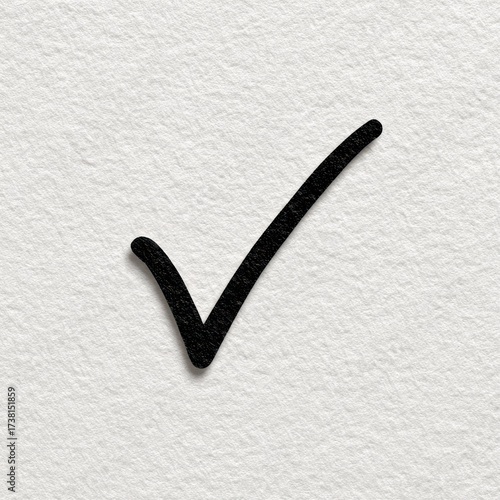 Simple black check mark symbol drawn on textured white paper background