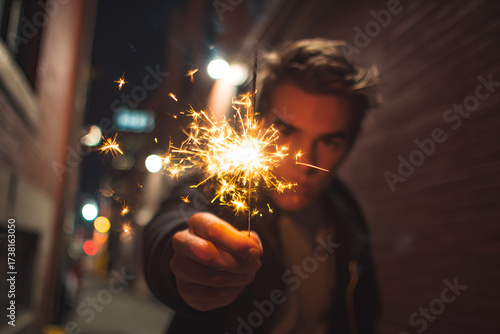 Man sparkler alleyway urban night Guy Fawkes celebration