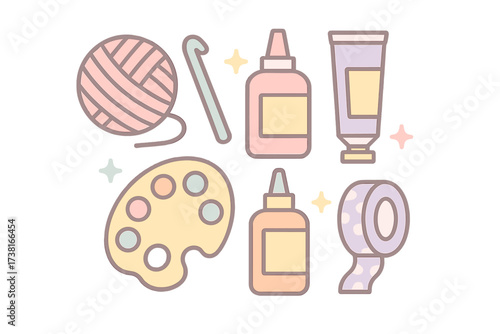 Collection of pastel craft supplies and art materials for creative projects