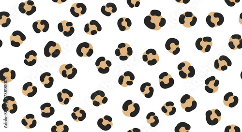 Seamless scattered pattern of animalistic spots on a white background adding a timeless elegance