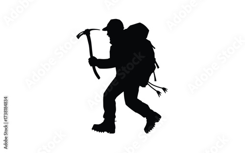 Silhouette of a climber with ice axe and backpack preparing for adventure