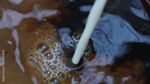 4K footage Milk Mixing into Iced Coffee.