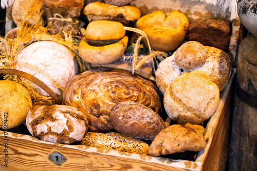 Wallpaper Mural A large selection of wheat and rye breads in a wooden chest in the village. Baked goods made from flour at a village bakery, close-up Torontodigital.ca