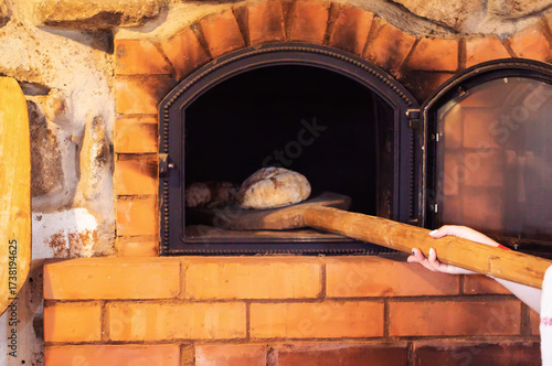 Wallpaper Mural Baking rye bread in a rustic oven, close-up Torontodigital.ca