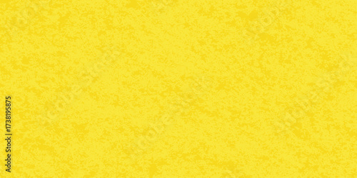 Roughly textured yellow paper and sponge create a vintage grunge background pattern