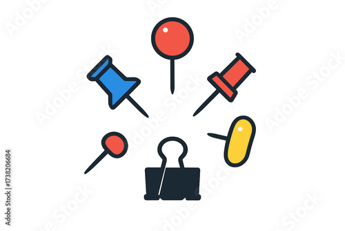 Assortment of colorful office pushpins thumbtacks and a binder clip