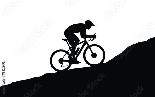 Dynamic silhouette of a cyclist ascending a hill in a sports moment