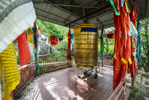 Buddhist temple with prayer wheel and pennants, forest trail, Jiaju, Danba county, Garzê Tibetan Autonomous Prefecture, Sichuan,  China