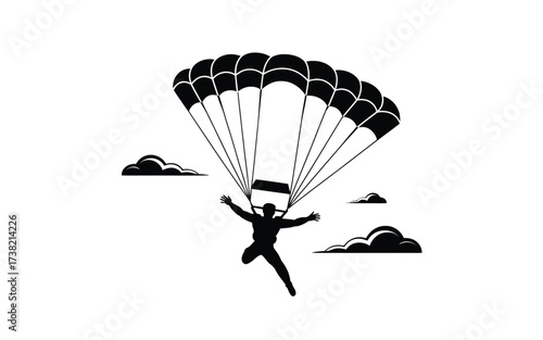 Silhouette of a skydiver descending with parachute open against a cloudy sky