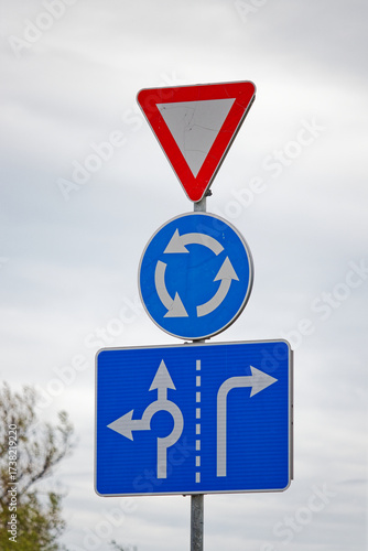 European Road Signs Showing Yield, Roundabout Ahead and Lane Usage Directions