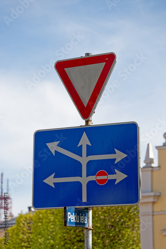 European Give Way Sign with Lane Directions Showing Right Turn Ban and Multiple Allowed Routes