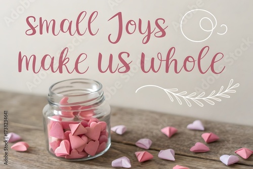 A jar filled with origami hearts beside motivational text