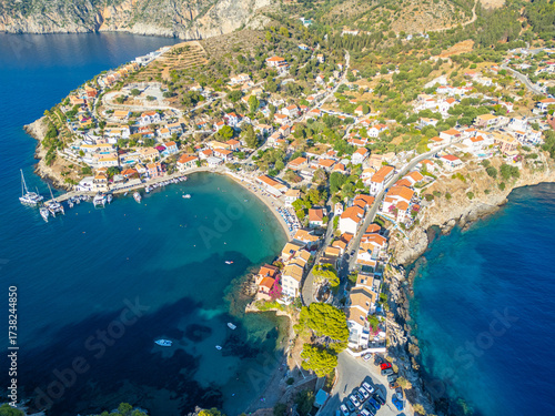 Aerial Panoramic of Assos Village in Kefalonia, Greece: Colorful Houses, Beach, Harbor and crystal clear turquoise waters