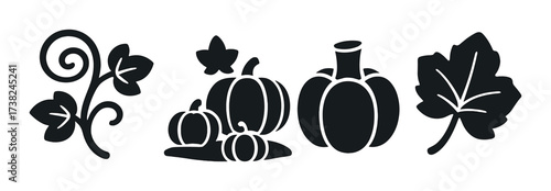 Silhouette of autumn leaves and pumpkins on green background