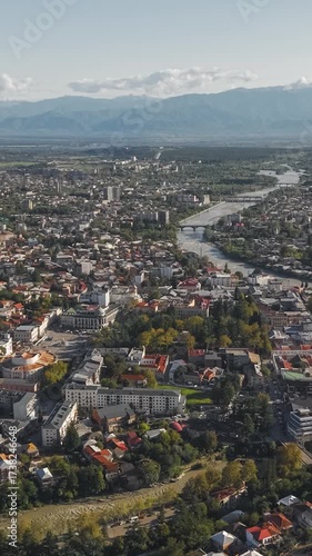 Aerial view of Kutaisi with the Rioni River and Mountains. Vertical video