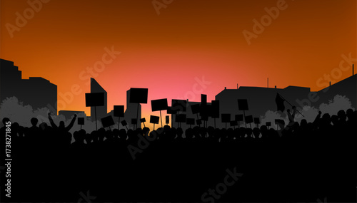A powerful silhouette of a crowd of people holding protest signs and banners against a vibrant, fiery sunset.