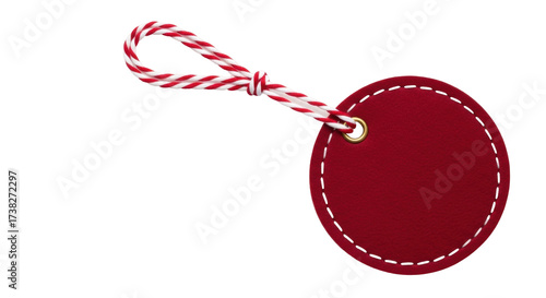 Isolated decorative gift tag with loop of red and white twine, blank price label