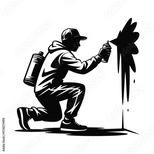 Urban artist silhouette spray painting with graffiti cans on a wall