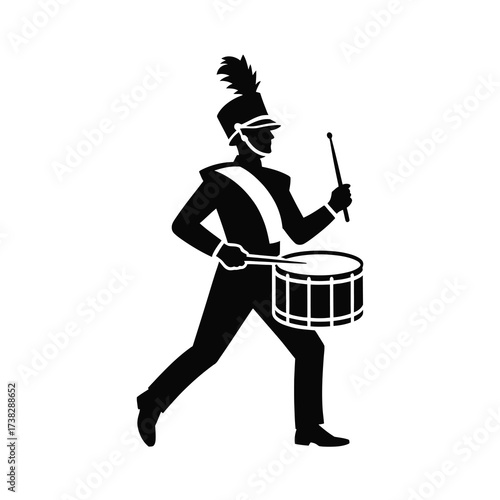Silhouette of a drummer in parade uniform with drumsticks and drum