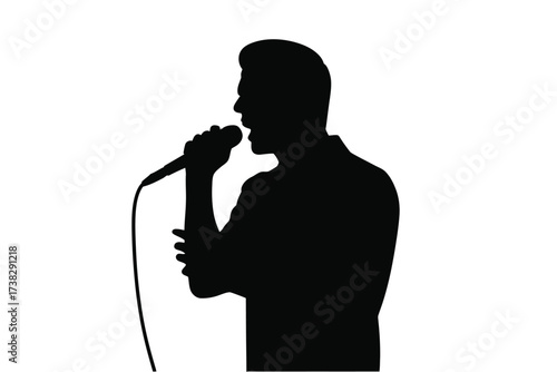 Silhouette of a man singing into a microphone on a plain backdrop