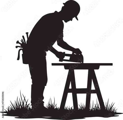 Silhouette carpenter working with planer on sawhorse