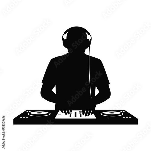 Silhouette of a dj with headphones and turntables ready to mix music