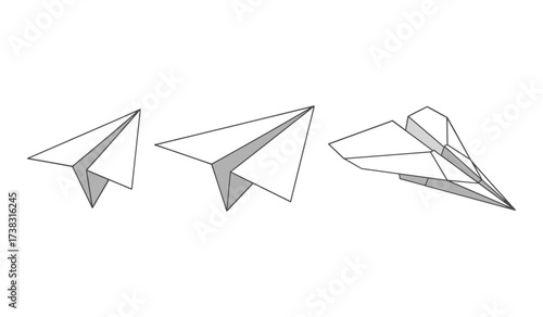 Three paper airplanes in different sizes and angles on white background origami flight