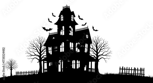 Silhouette of a spooky haunted house with bats flying around it, surrounded by bare trees and a picket fence.