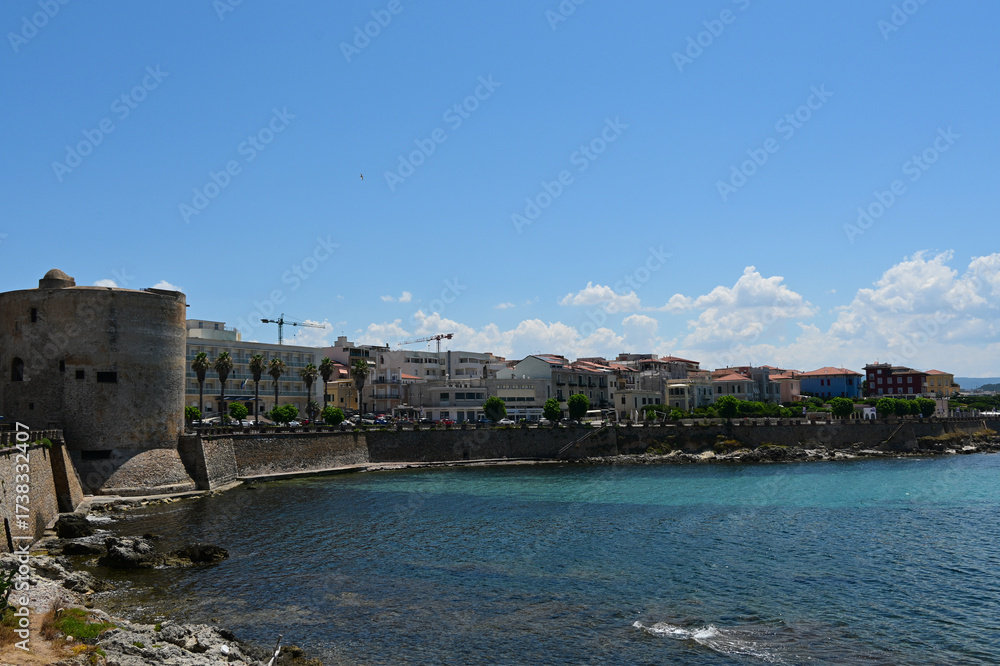 Obraz premium Cityscape of historical part of Alghero town. Waterfront of Alghero town in Sardinia. Alghero old town, street view, Sardinia, Italy