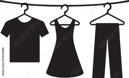 Black silhouette of clothes hanging on a clothesline.