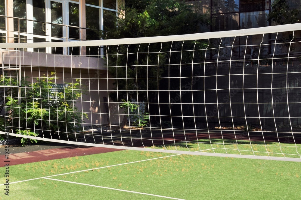 Fototapeta premium Sports competition. Part of a volleyball net awaits a match.