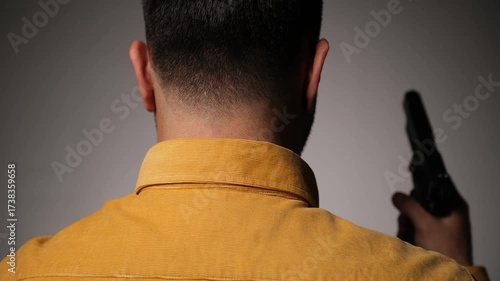 Man Threatening Another with a Handgun