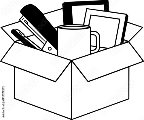 A cardboard box containing the office belongings of a laid-off employee: a stapler, a mug, and a photo frame. The concept of layoffs, unemployment, and the last day of work.
