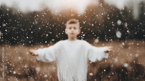 A young boy embracing the joy of a snowy, festive moment